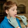 A boy with ARK's oral navigator inside mouth