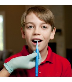 A boy training tongue elevation with the Z-vibe fine tip