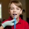 A boy training tongue elevation with the Z-vibe fine tip
