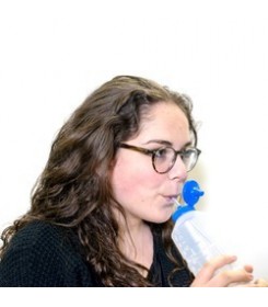 Woman drinking from a TALK TOOLS bottle
