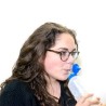 Woman drinking from a TALK TOOLS bottle
