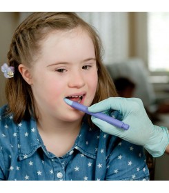 A girl during oralmotor therapy with the Z-vibe bite and chew tip xl